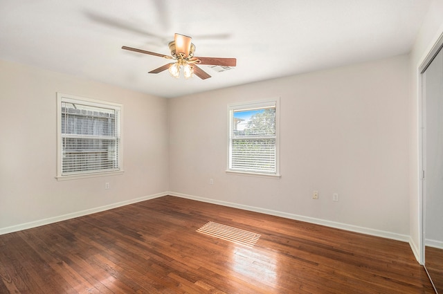 empty room featuring dark hardwood / wood-style floors and ceiling fan