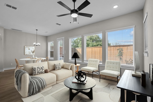 16022 Mason Run Dr, Houston, TX 77079 - living room featuring baseboards, ceiling fan with notable chandelier, visible vents, and wood finished floors