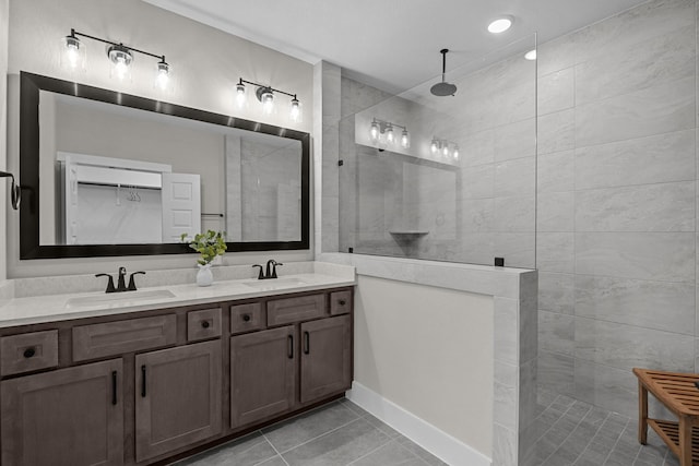 16022 Mason Run Dr, Houston, TX 77079 - bathroom with tile patterned flooring, double vanity, a sink, and a walk in shower