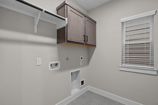 16022 Mason Run Dr, Houston, TX 77079 - laundry room featuring baseboards, gas dryer hookup, washer hookup, cabinet space, and electric dryer hookup