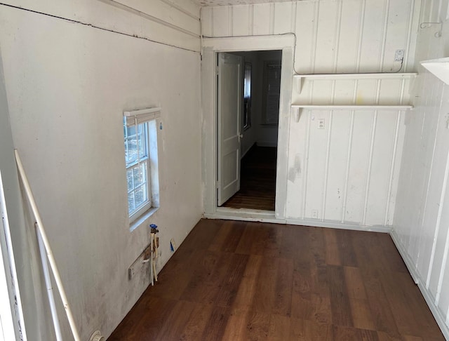 hallway with dark hardwood / wood-style floors