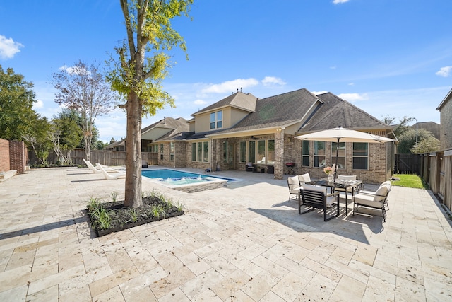 view of pool with a patio and a hot tub