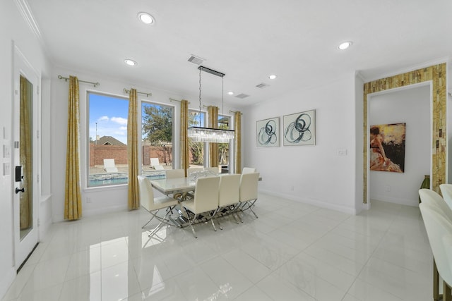 dining room with light tile patterned floors and ornamental molding