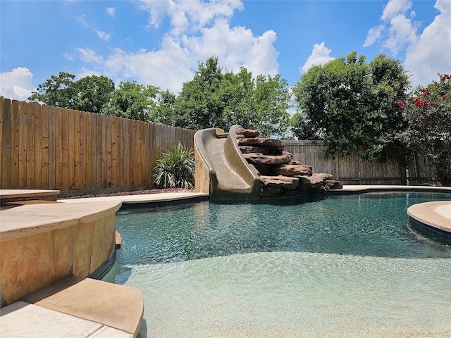 view of pool featuring a water slide