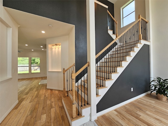 staircase featuring hardwood / wood-style flooring