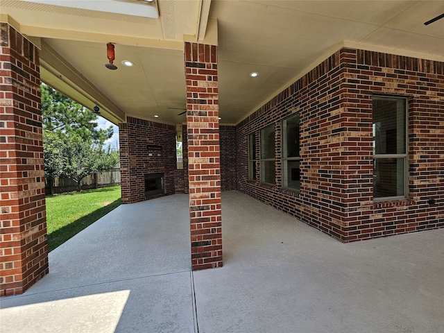 view of patio / terrace with a brick fireplace