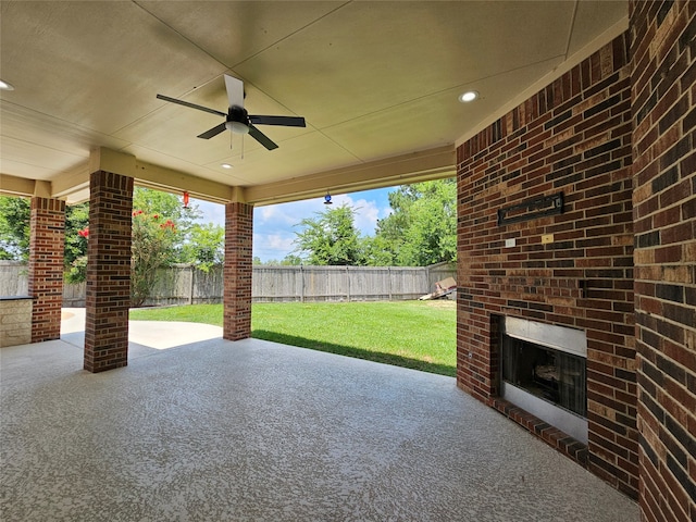 view of patio / terrace featuring an outdoor brick fireplace