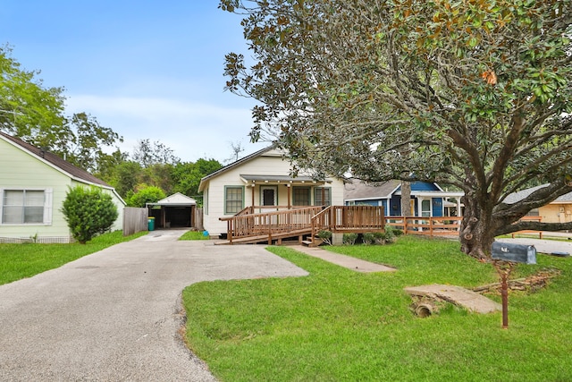 view of front of home featuring a deck and a front yard