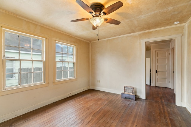 unfurnished room with ceiling fan, dark hardwood / wood-style flooring, and crown molding