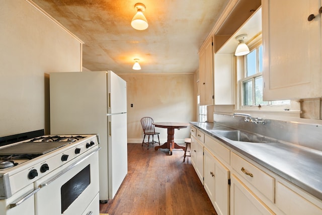 kitchen featuring sink, dark hardwood / wood-style floors, white gas range, ornamental molding, and stainless steel counters