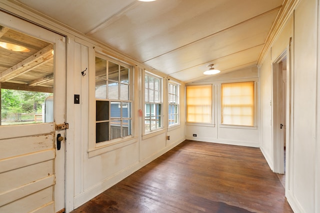 unfurnished sunroom featuring vaulted ceiling with beams and wooden ceiling