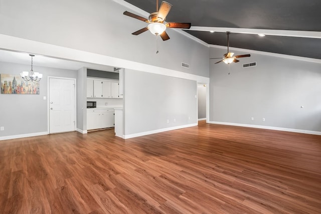 unfurnished living room featuring hardwood / wood-style floors, ceiling fan with notable chandelier, and high vaulted ceiling