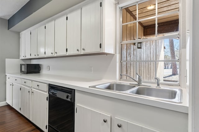 kitchen featuring black appliances, dark hardwood / wood-style floors, white cabinetry, and sink