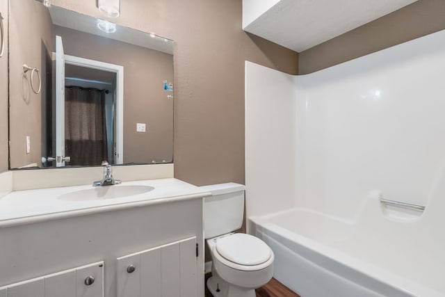 full bathroom featuring hardwood / wood-style flooring, vanity, toilet, and tub / shower combination