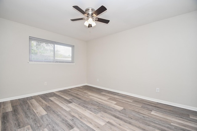 unfurnished room featuring hardwood / wood-style floors and ceiling fan