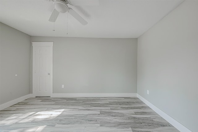 spare room featuring ceiling fan and light hardwood / wood-style floors