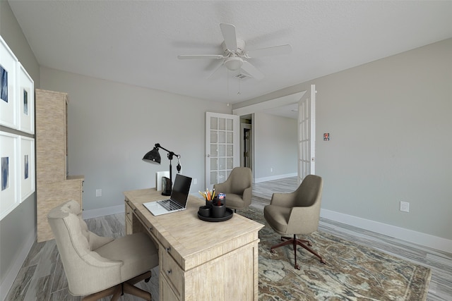 office space with ceiling fan, wood-type flooring, a textured ceiling, and french doors