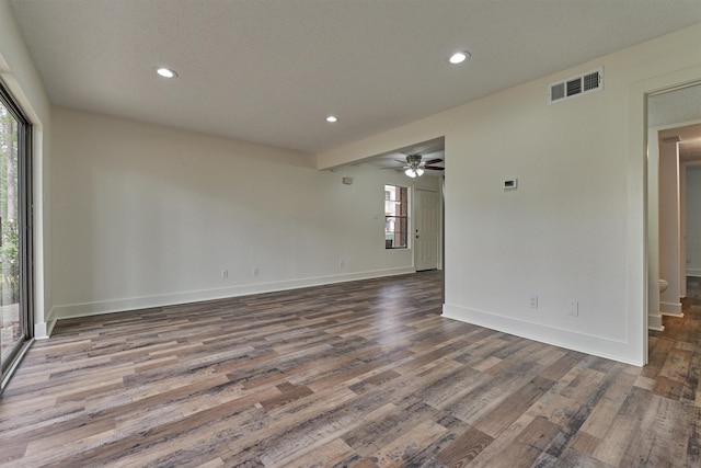 12900 Walden Rd Unit 105A, Montgomery, TX 77356 - empty room featuring plenty of natural light, wood finished floors, recessed lighting, and baseboards