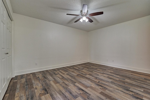 12900 Walden Rd Unit 105A, Montgomery, TX 77356 - spare room featuring dark wood-type flooring, ceiling fan, a textured ceiling, and baseboards