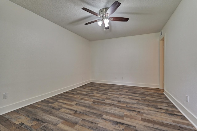 12900 Walden Rd Unit 105A, Montgomery, TX 77356 - unfurnished room featuring ceiling fan, dark wood finished floors, a textured ceiling, and baseboards