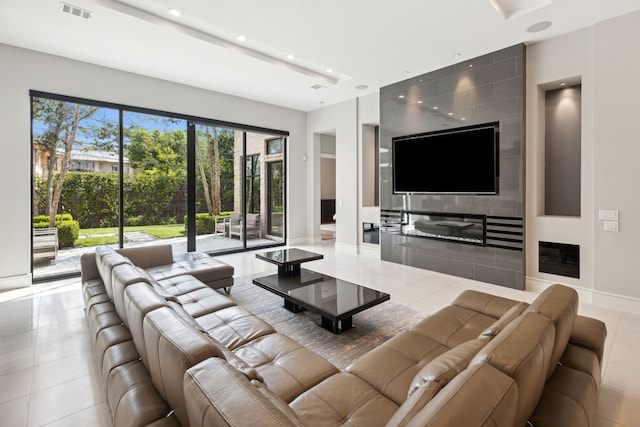 tiled living room featuring a fireplace