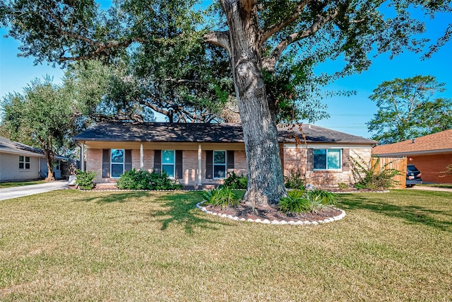 ranch-style home with a front lawn