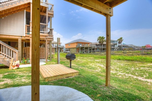 view of yard featuring a patio and a deck