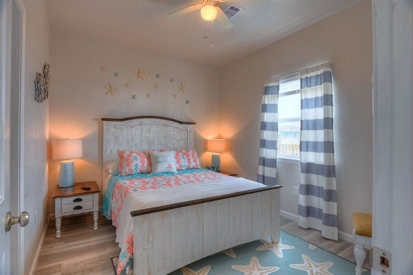 bedroom featuring light hardwood / wood-style flooring and ceiling fan