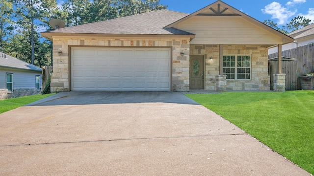 view of front of house featuring a front yard and a garage