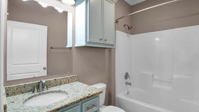 full bathroom featuring washtub / shower combination, vanity, and toilet