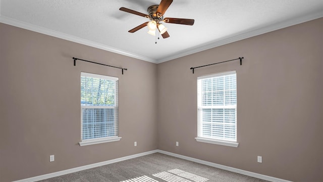 unfurnished room featuring carpet, a textured ceiling, ceiling fan, and ornamental molding