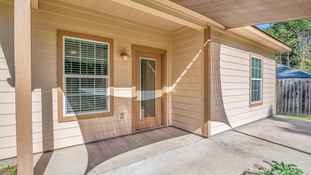 entrance to property featuring a patio area