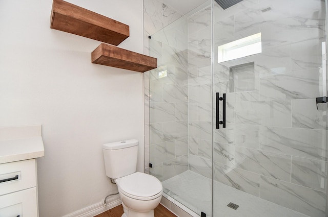 bathroom with a shower with shower door, toilet, and wood-type flooring