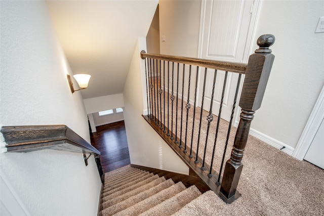 staircase featuring hardwood / wood-style floors