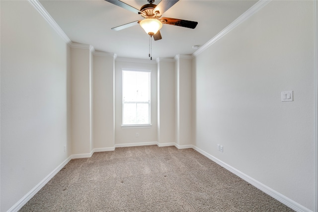 carpeted empty room featuring crown molding and ceiling fan