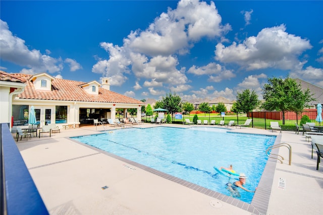 view of swimming pool featuring a patio