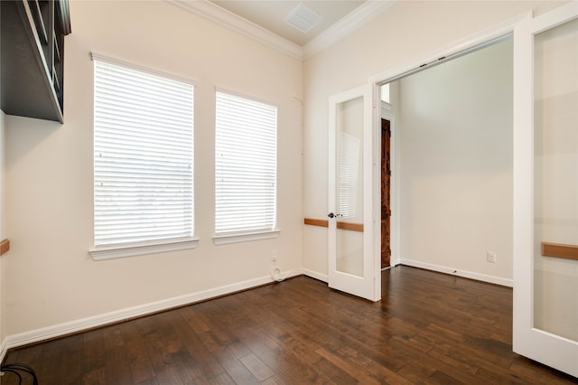 unfurnished room with crown molding, dark wood-type flooring, and a healthy amount of sunlight