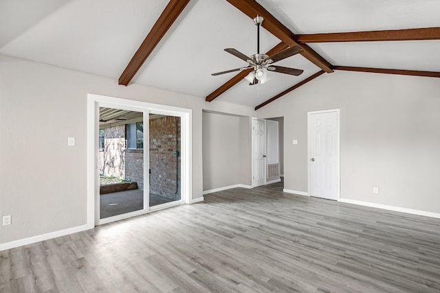 unfurnished living room with vaulted ceiling with beams, ceiling fan, and hardwood / wood-style flooring