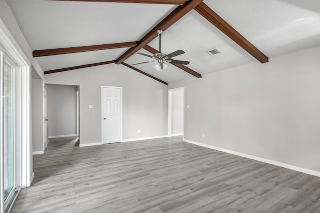 unfurnished living room with light wood-type flooring, a textured ceiling, vaulted ceiling with beams, and ceiling fan