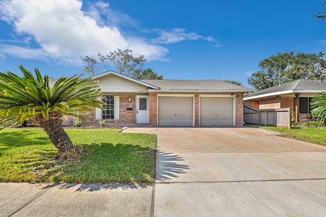 single story home with a front lawn and a garage