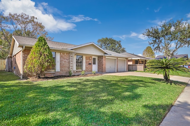 ranch-style house featuring a garage and a front lawn