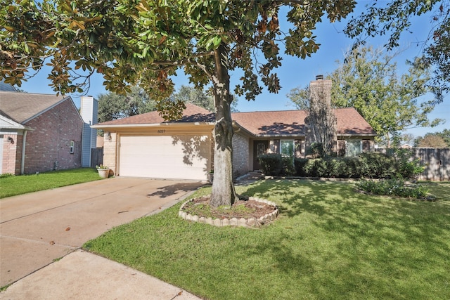 ranch-style house featuring a front lawn and a garage