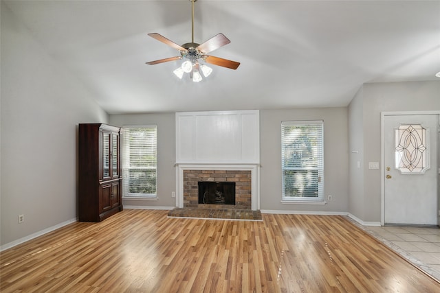 unfurnished living room with ceiling fan, a healthy amount of sunlight, and light hardwood / wood-style floors