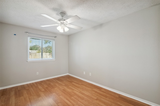 unfurnished room featuring ceiling fan, a textured ceiling, and light hardwood / wood-style flooring