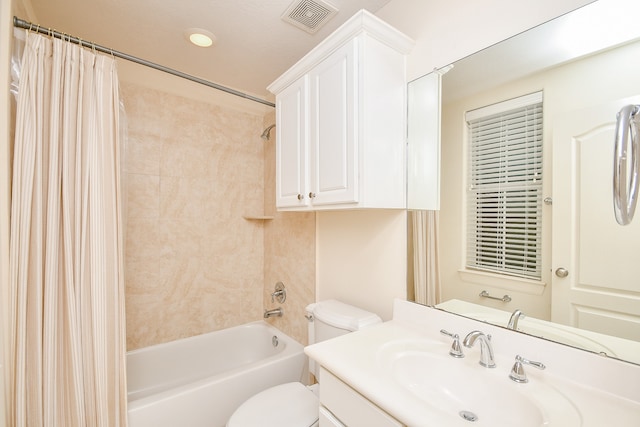 full bathroom with vanity, toilet, and shower / bathtub combination with curtain