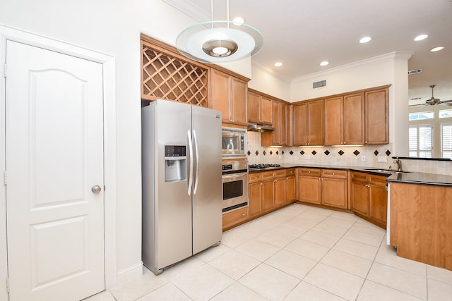 kitchen featuring backsplash, sink, ornamental molding, appliances with stainless steel finishes, and light tile patterned flooring