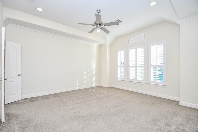 empty room with ceiling fan, light colored carpet, and ornamental molding