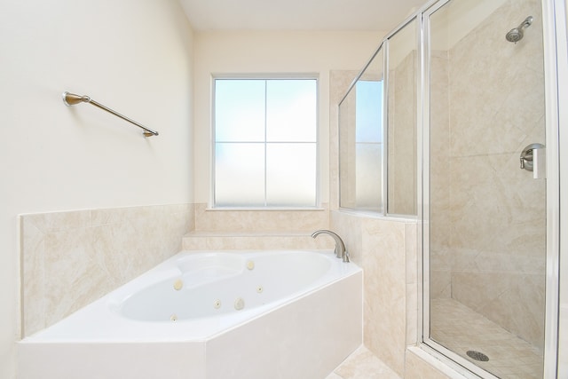 bathroom with separate shower and tub