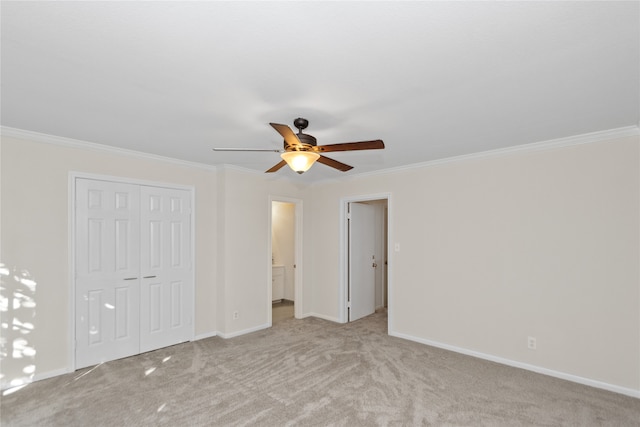 unfurnished bedroom with light carpet, a closet, ceiling fan, and crown molding