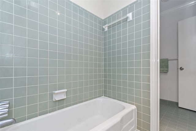 bathroom with tile patterned flooring and tiled shower / bath combo